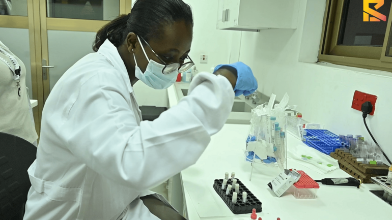 Senam, working in the lab Senam, a research assistant working in the lab