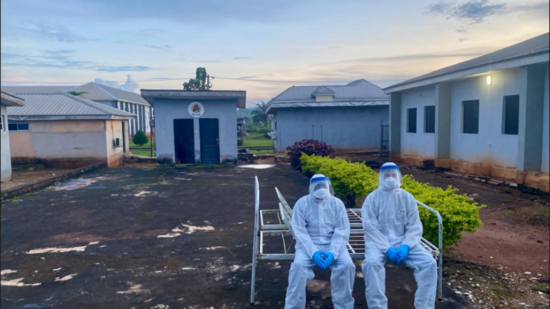 Two medical staff in protective suits
