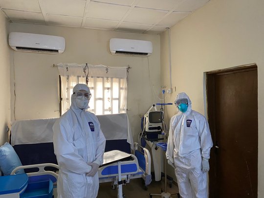 Wardteam in personal protective suits. Ward team