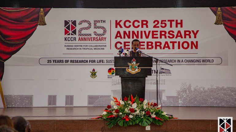 The Scientific Director of the KCCR, Prof. Richard Phillips The Scientific Director of the KCCR, Prof. Richard Phillips, stands at the flower-decked lectern and gives his speech.