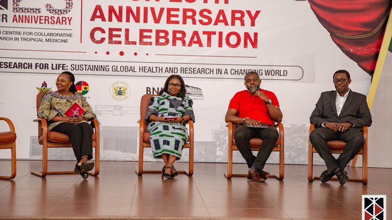 Closing panel discussion The photo shows two African female scientists and two African male scientists sitting in chairs on stage and discussing.