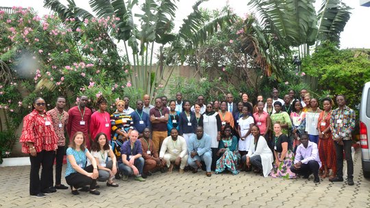 ASAAP annual meeting 2023. All members of the annual ASAAP study meeting in Benin standing in front of trees with flowers